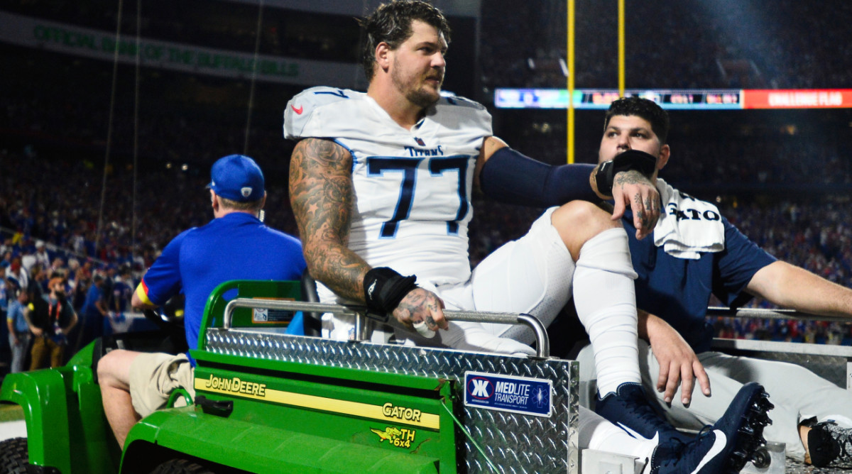 Titans’ Taylor Lewan Carted off Field With Injury Against Bills