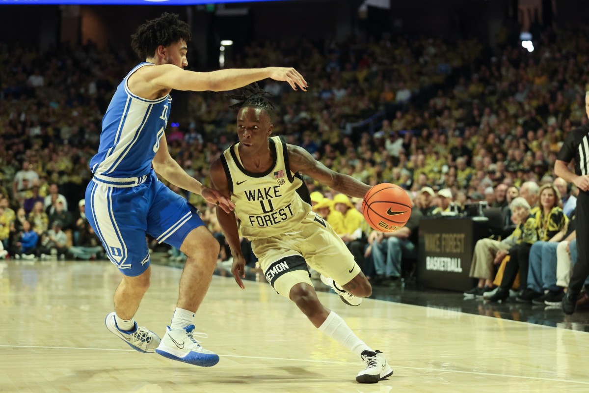 Wake Forest Demon Deacons guard Kevin Miller (0) drives the ball against Duke Blue Devils guard Jared McCain (0) during the first half at Lawrence Joel Veterans Memorial Coliseum in Winston-Salem, North Carolina, on Feb. 24, 2024.