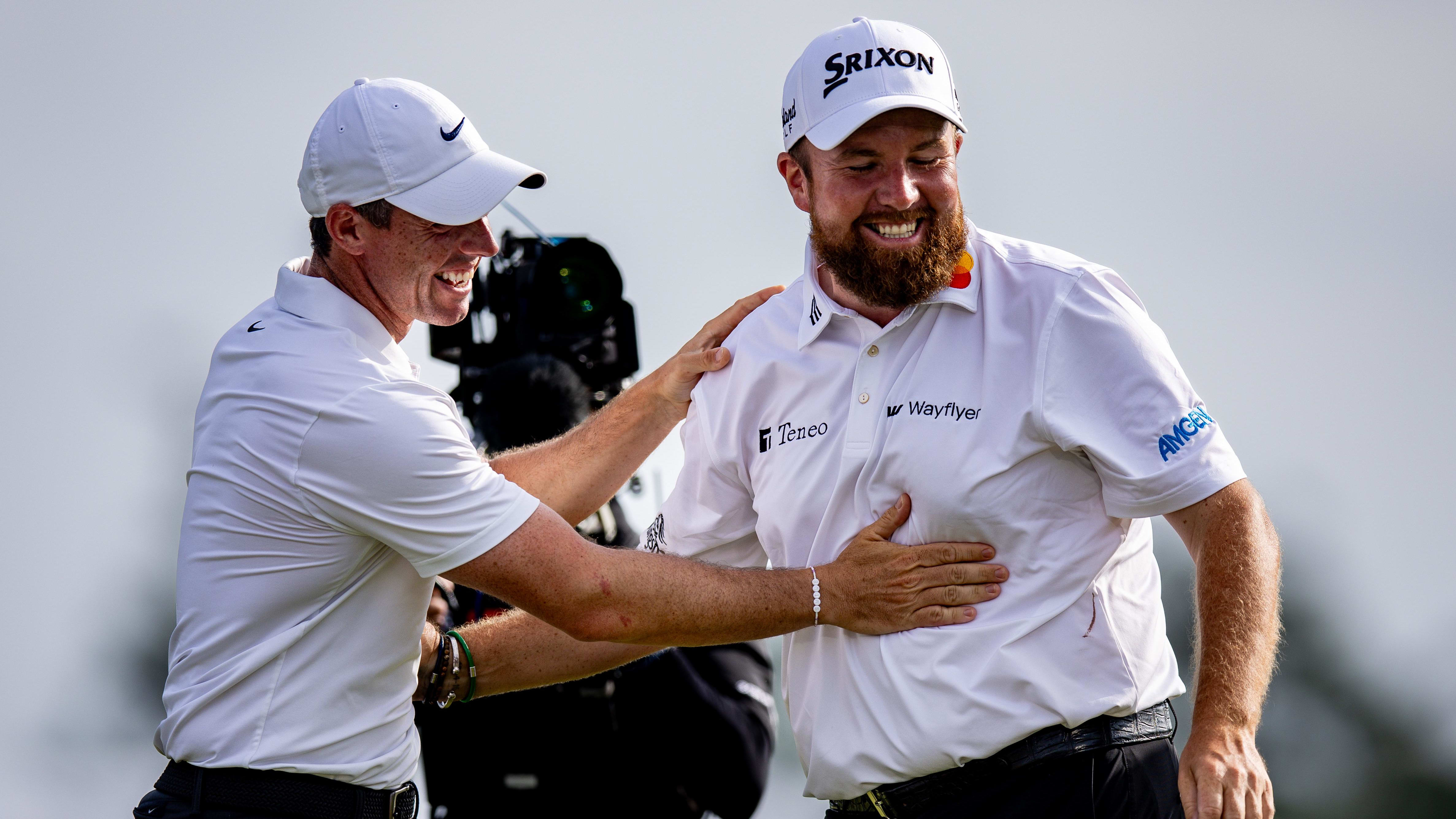 Shane Lowry hugs Rory McIlroy after winning the 2024 Zurich Classic.