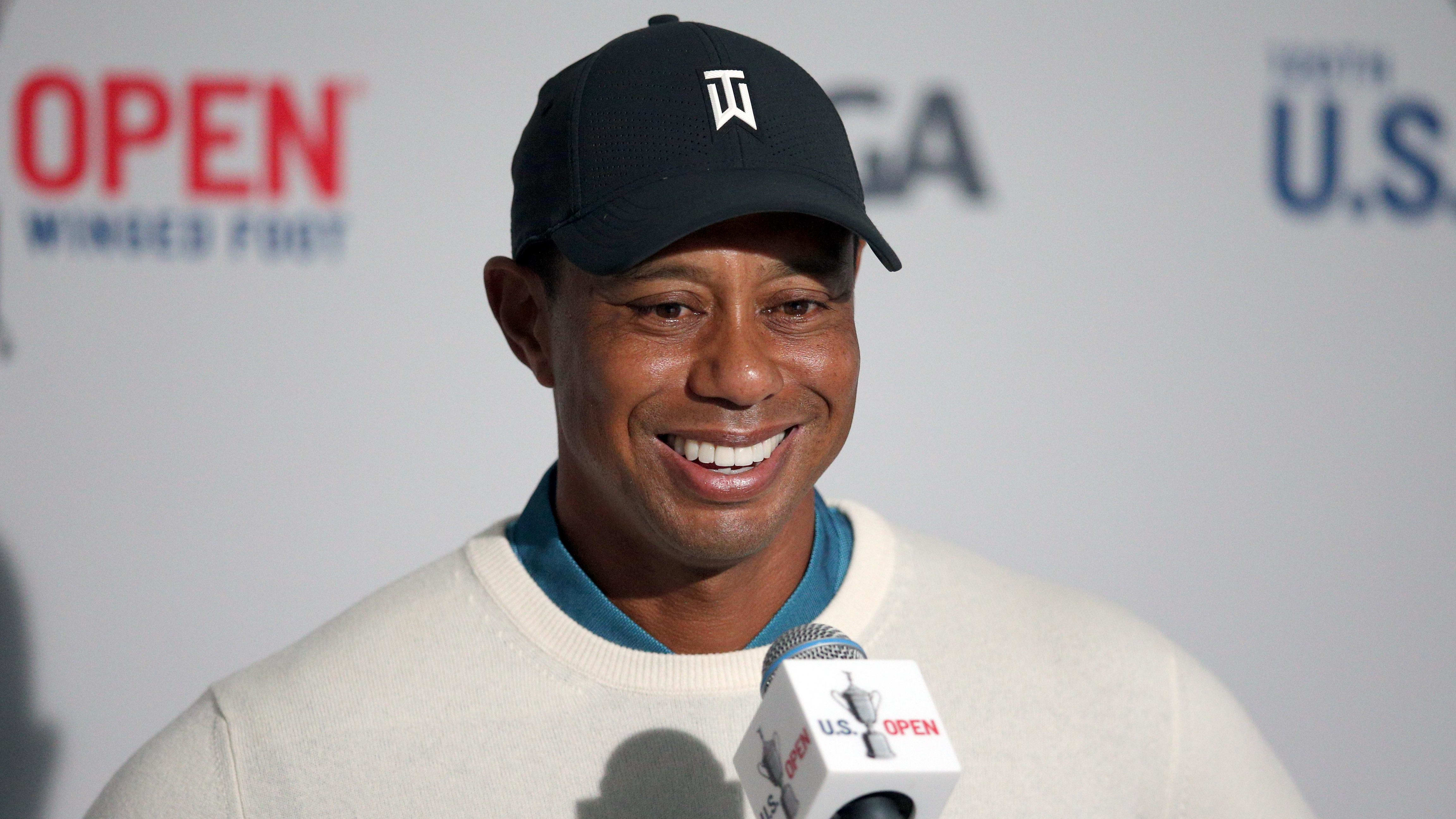 Tiger Woods talks to reporters following his second round at the 2020 U.S. Open.