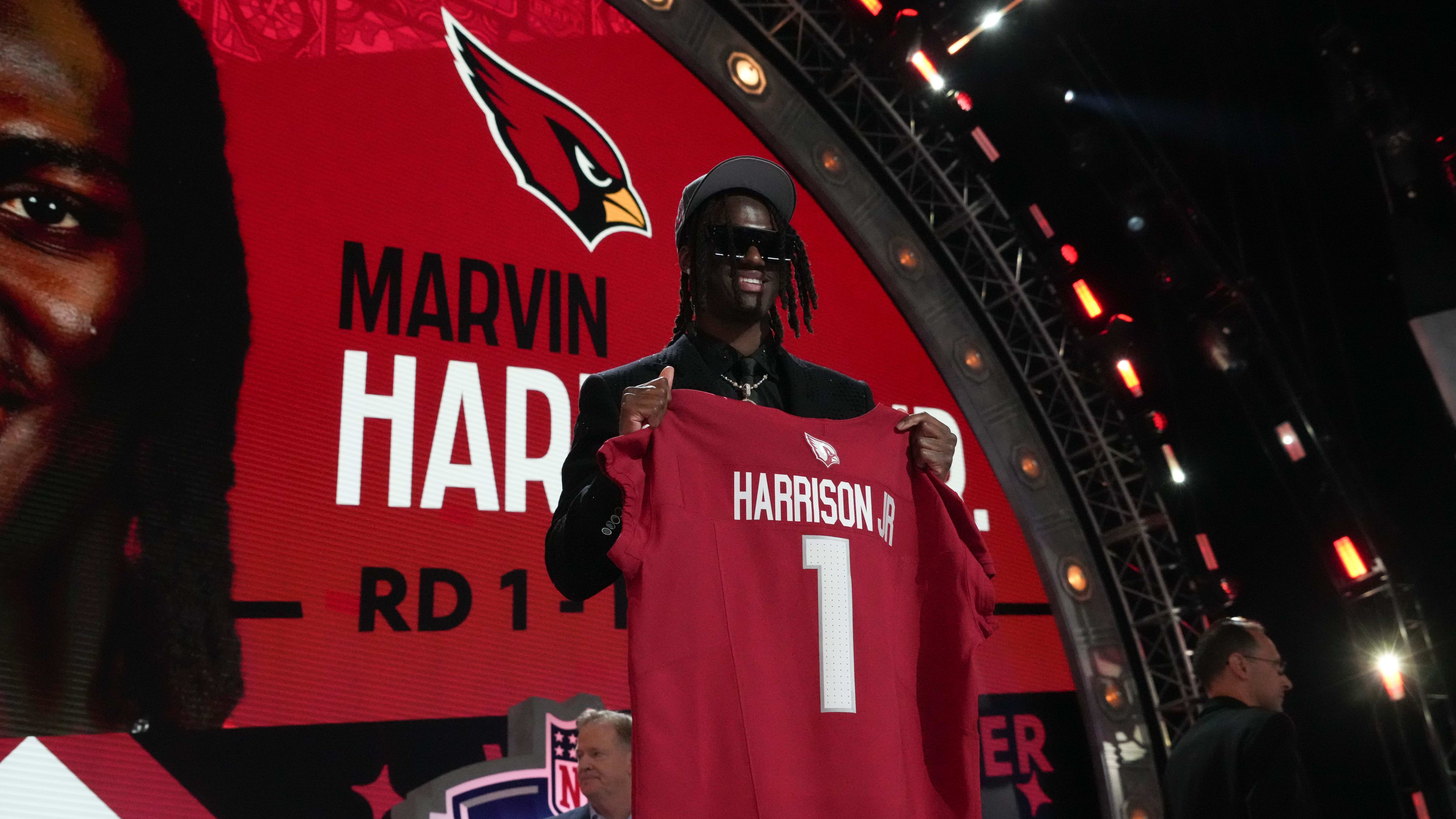 Cardinals wide receiver Marvin Harrison Jr. stands on the stage after being selected at the 2024 NFL draft